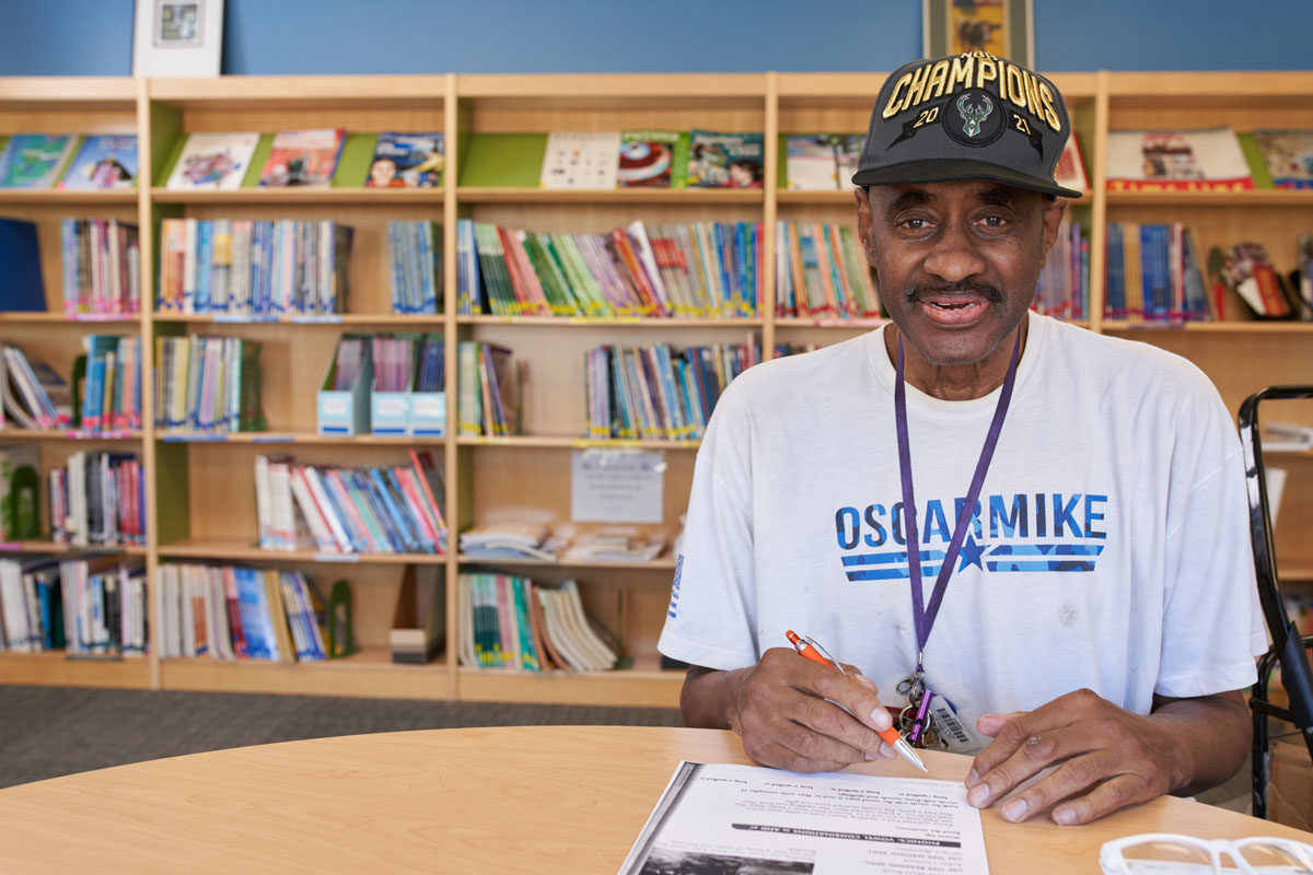 Man writing at a table