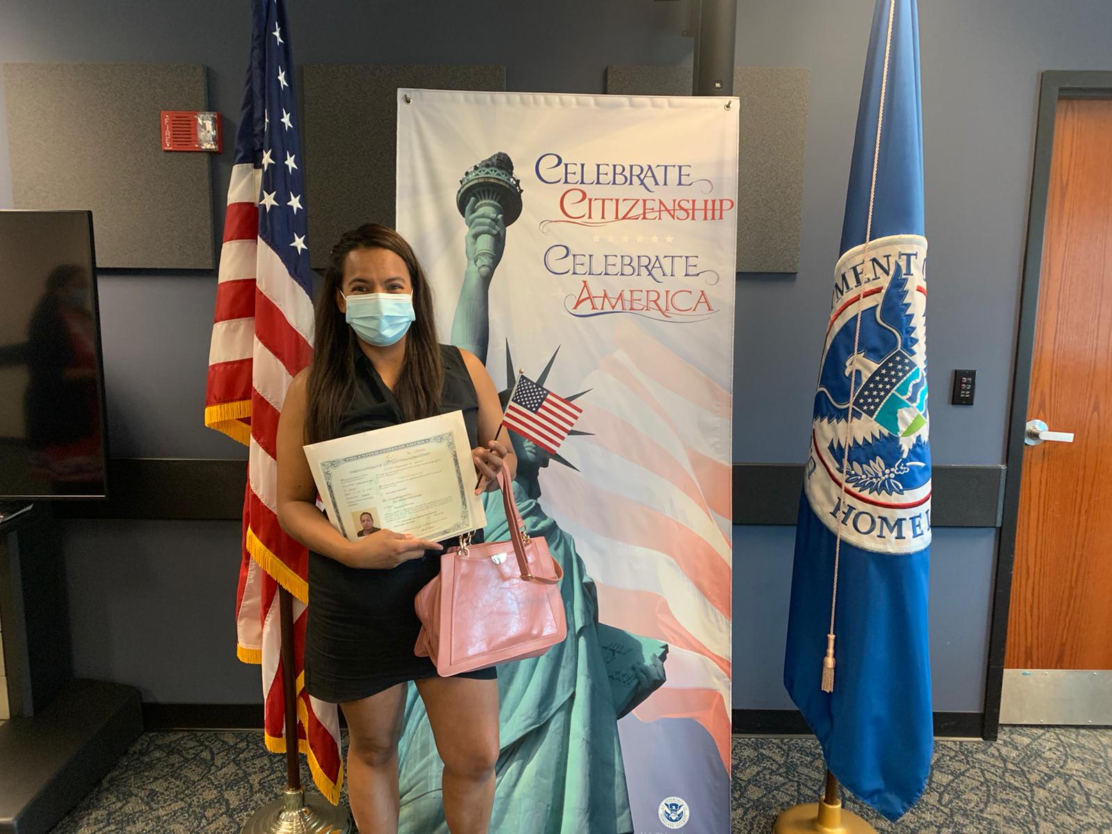 Student in front of flags