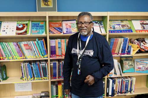 Claudel Boyd in front of books