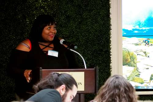 Stephanie speaks to the crowd at Reading Between the Wines 2019.